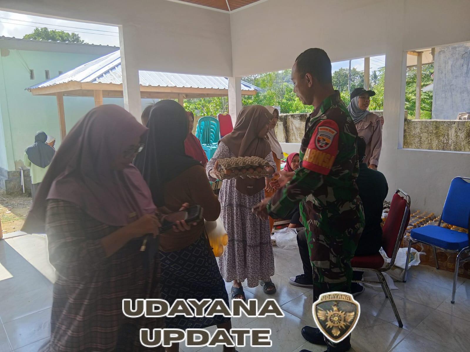 Babinsa Dampingi Penyaluran Gerakan Pangan Murah di Desa Aikkangkung