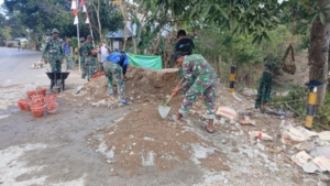 Perkuat Struktur Jalan, Satgas TMMD Bangun Tembok Penahan Jalan