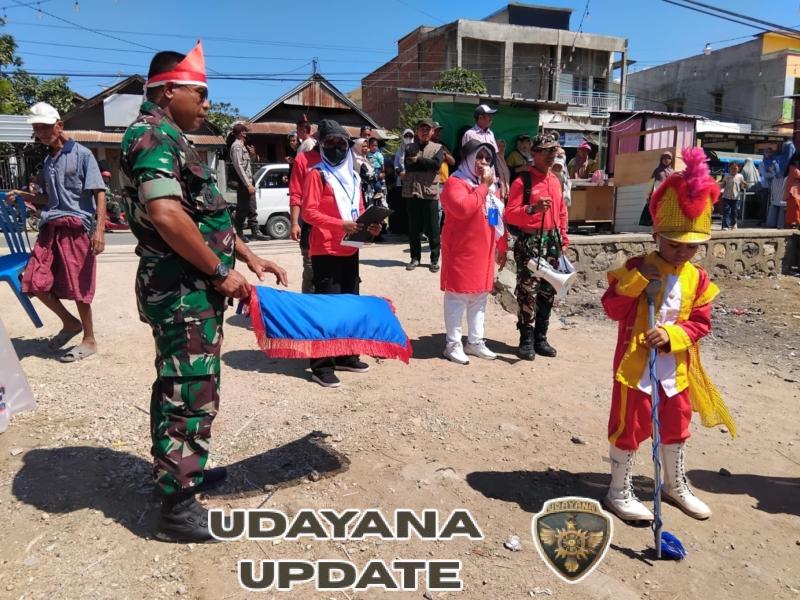 Babinsa Dari Koramil 1608-04 Woha Amankan Gerak Jalan Indah Sambut HUT RI ke-80