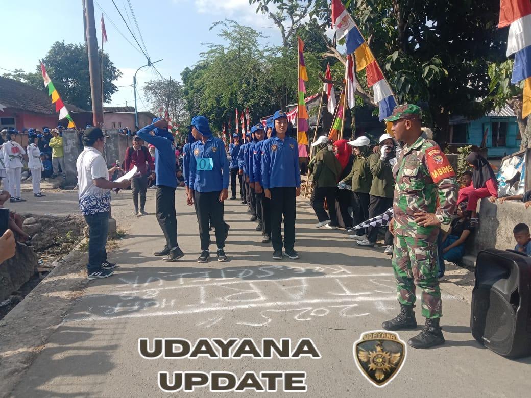 Meriahkan HUT ke-80 RI, Babinsa Ikut Amankan Lomba Gerak Jalan Tingkat SMP/SMA dan Umum
