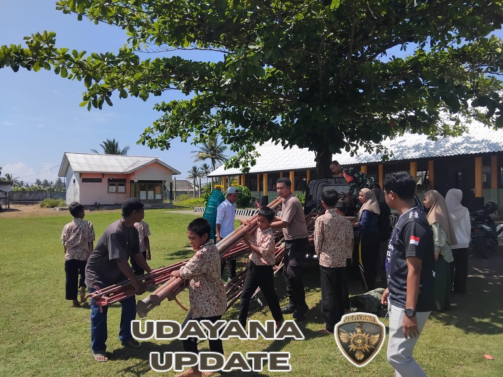 Babinsa Desa Ai’kangkung Bersama Warga Gotong Royong Dirikan Tenda Acara Pembagian Kartu KSB Maju