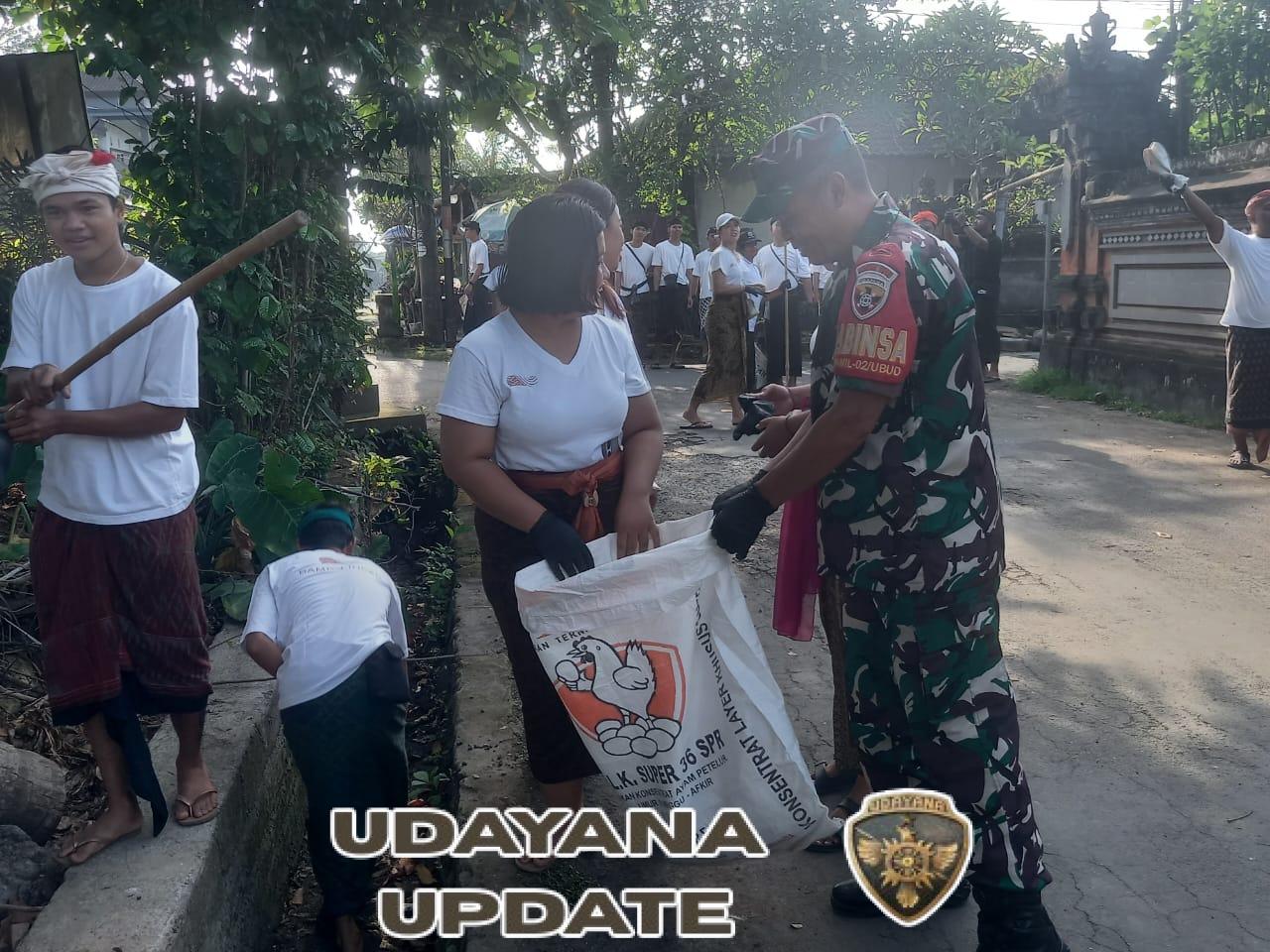 Babinsa Sayan Ajak Warga Wujudkan Lingkungan Bersih di HUT ke-34 Desa Sayan