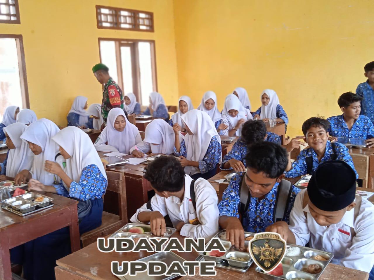 Sertu Sahlan Kawal Penyaluran MBG di Kecamatan Lambu, Sasaran Sekolah hingga Posyandu