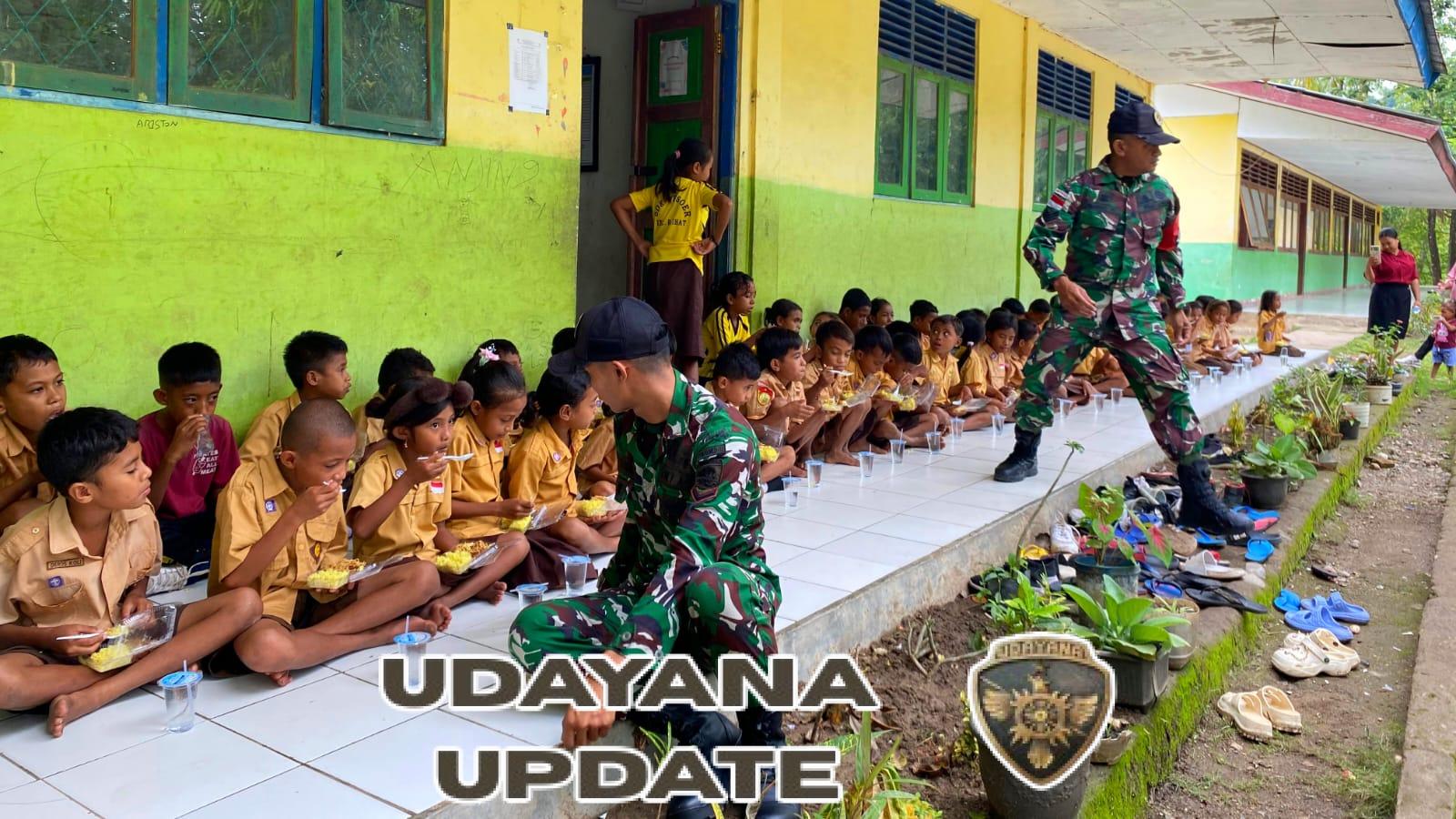 Yonarmed 12 Kostrad Beri Nasi Kuning Gratis untuk Siswa di Perbatasan Raihat
