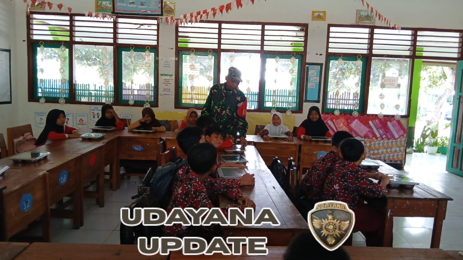 Babinsa Taliwang Dampingi Anak Sekolah Nikmati Makan Bergizi Gratis