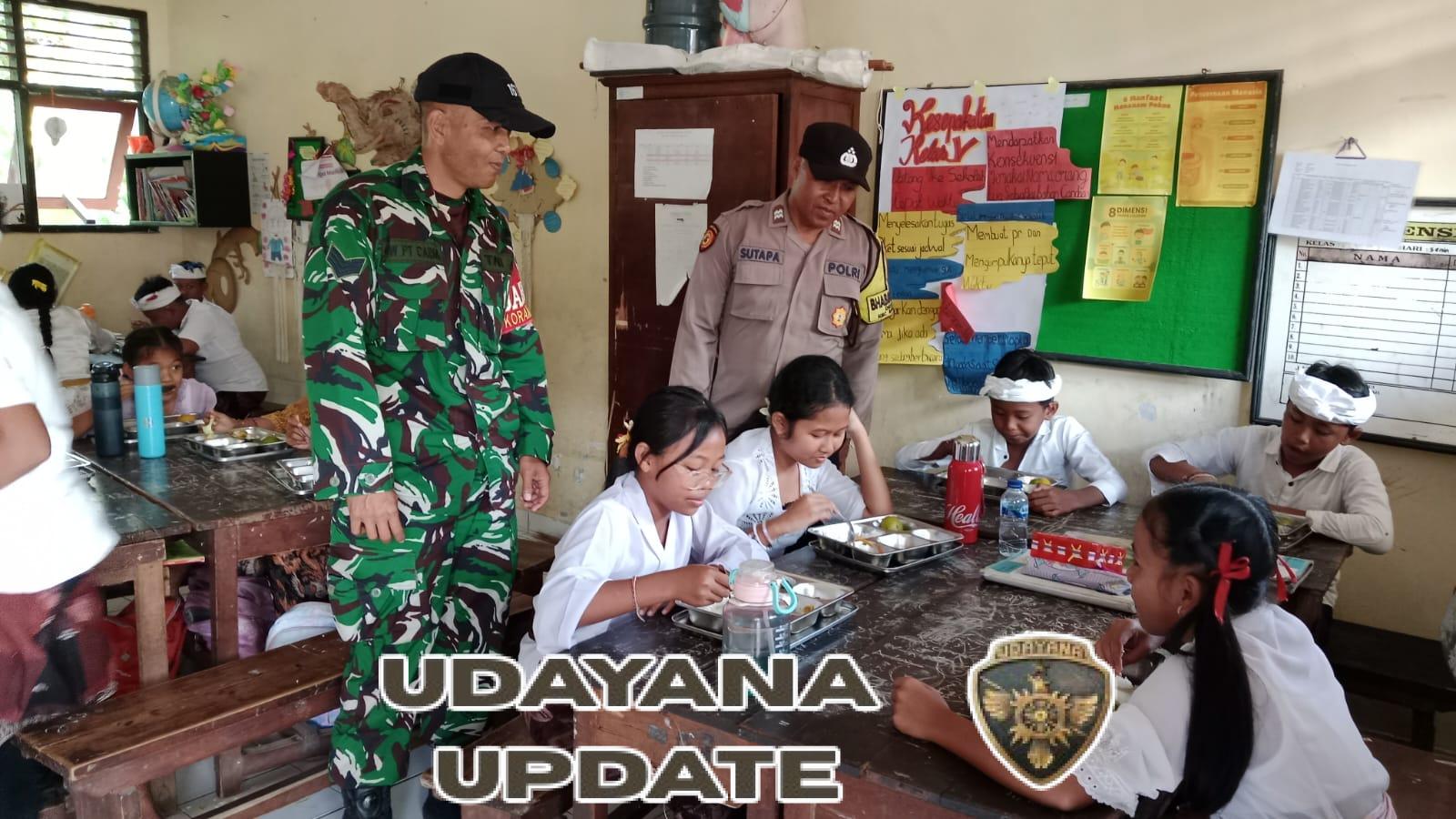 Aparat TNI Polri Di Klungkung Kawal Distribusi MBG Di Wilayah Desa Tusan